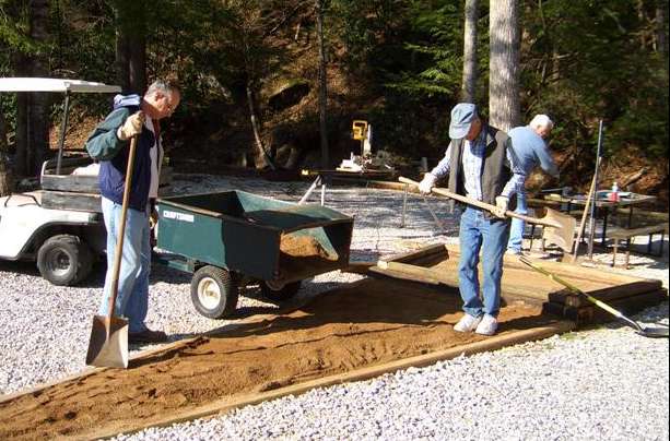 Larry helping spread soil