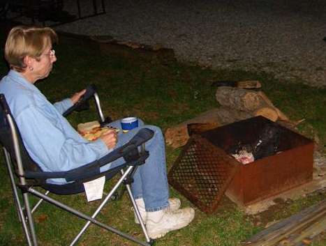 One relaxed lady, isn't a campfire enchanting?