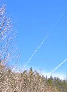 Contrail passing "through" the moon