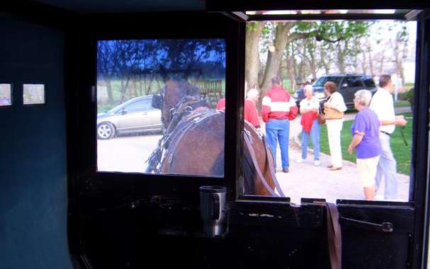 What the view from inside an Amish buggy looks like, note the coffe cup, all the comorts of home