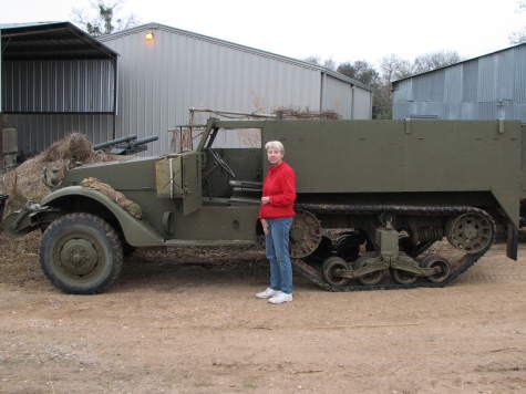 Little old lady beside half-track