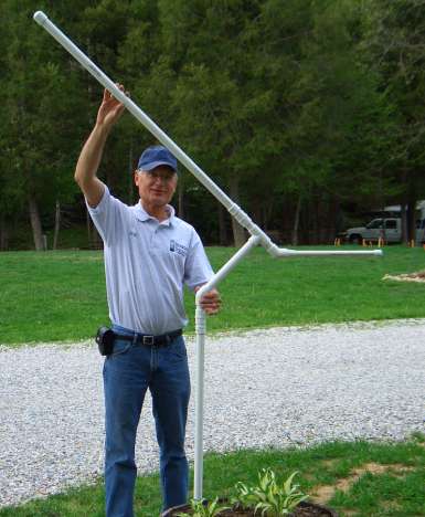 Handsome male model posing beside the finished pole