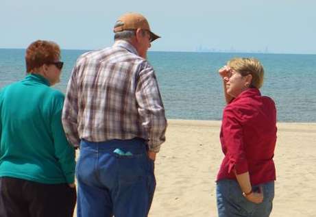 Sand, water, city and family